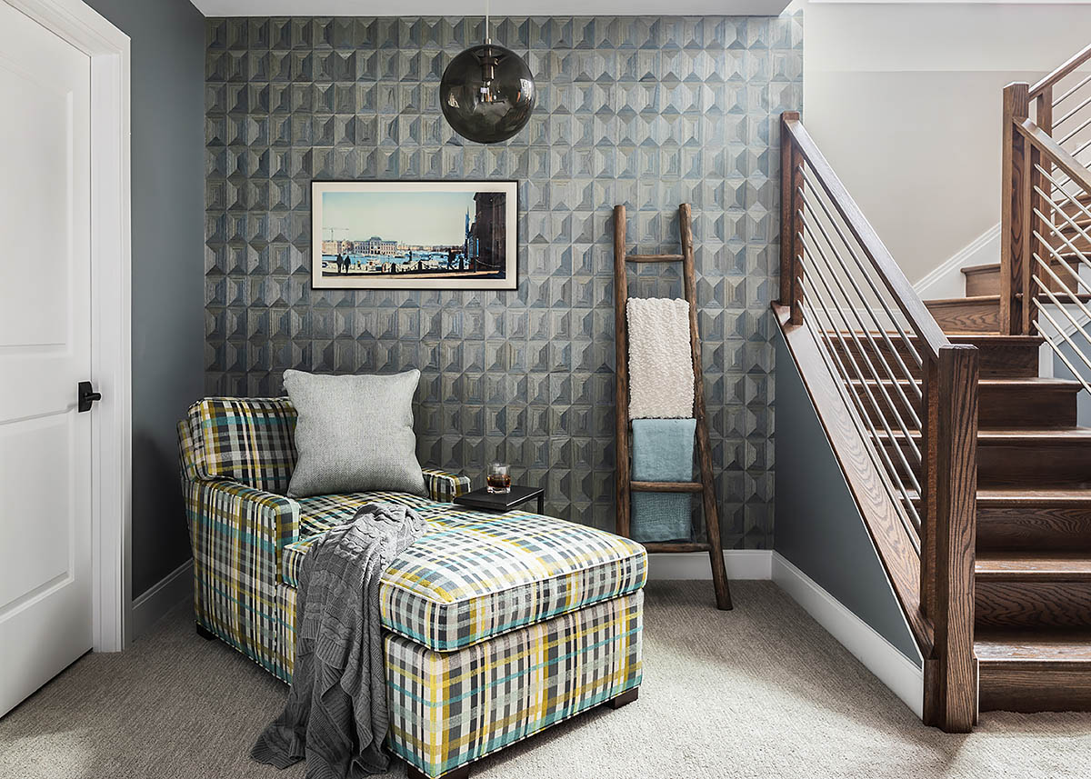 Chaise lounge detail with wood wallcovering and art work