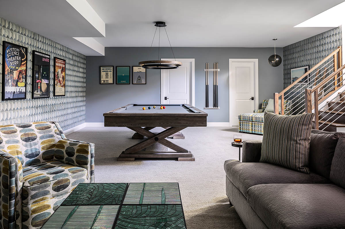 Billiard room design showing chaise, pool table, art, seating area