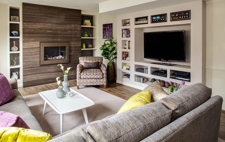 Full view of basement seating area and media wall