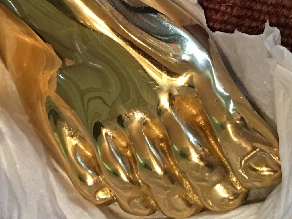 Close-up of brass foot on Kelly Wearstler Foot Stool