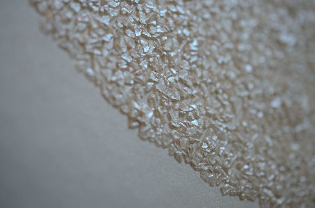 Close-up of mica-flecked circle on Eykon Source One Ulf Moritz Wall Couture's Lavish pattern
