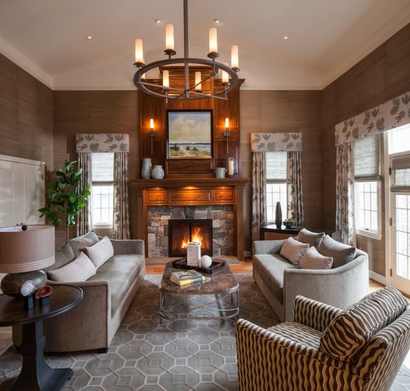 Family room with custom-finished chandelier and fireplace sconces