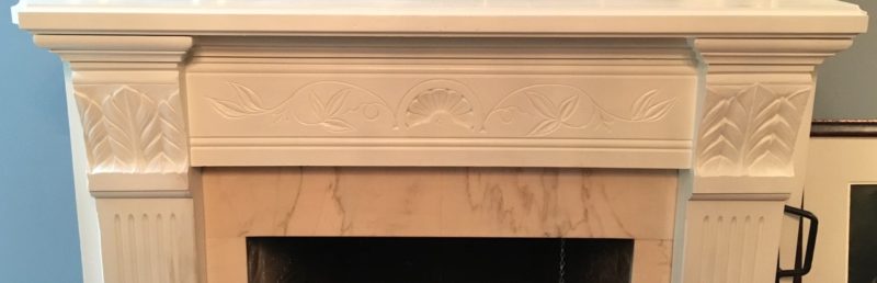 Detail shot of dining room fireplace carvings before