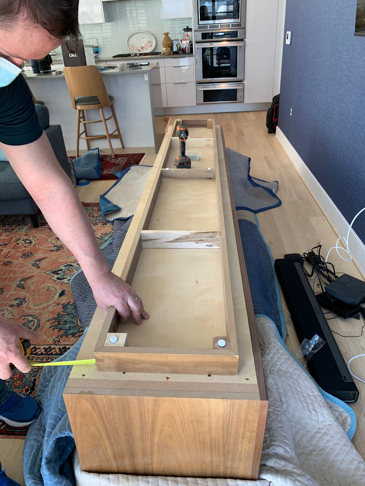 Installation of entertainment console in DC condo living room