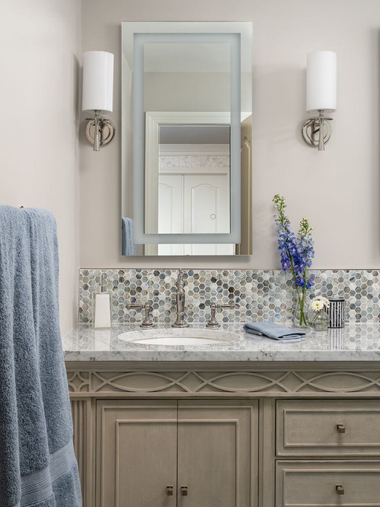 Bath remodel front shot of vanity with mirror and lighting