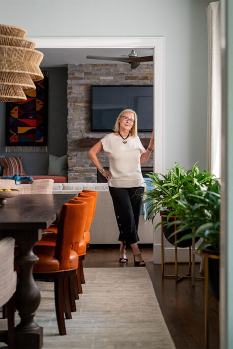 Andrea standing in doorway of client's home.