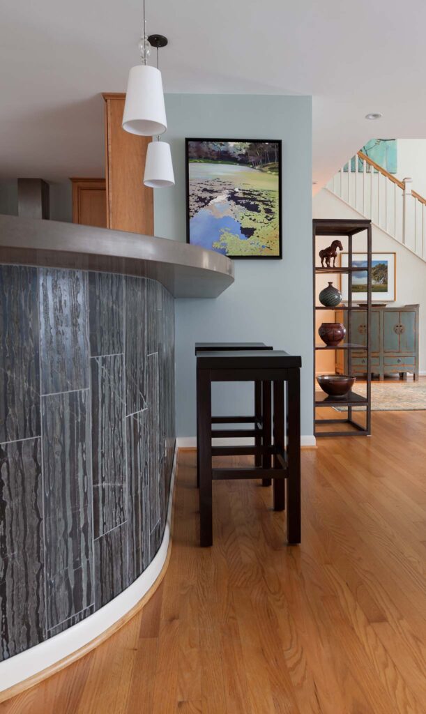 Crosscut marble and curved kitchen island in Arlington, VA by A. Houck Designs.