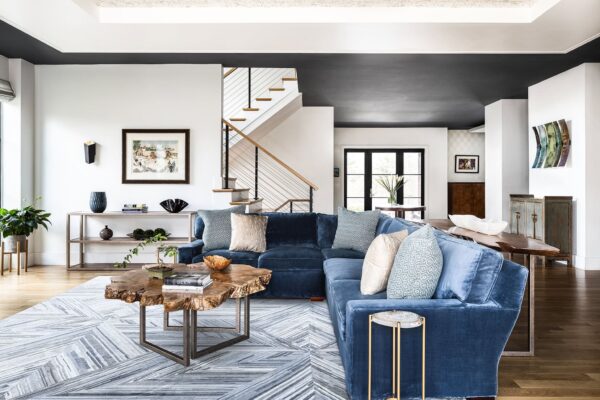 View of family room, entrance and foyer, console and stairs.