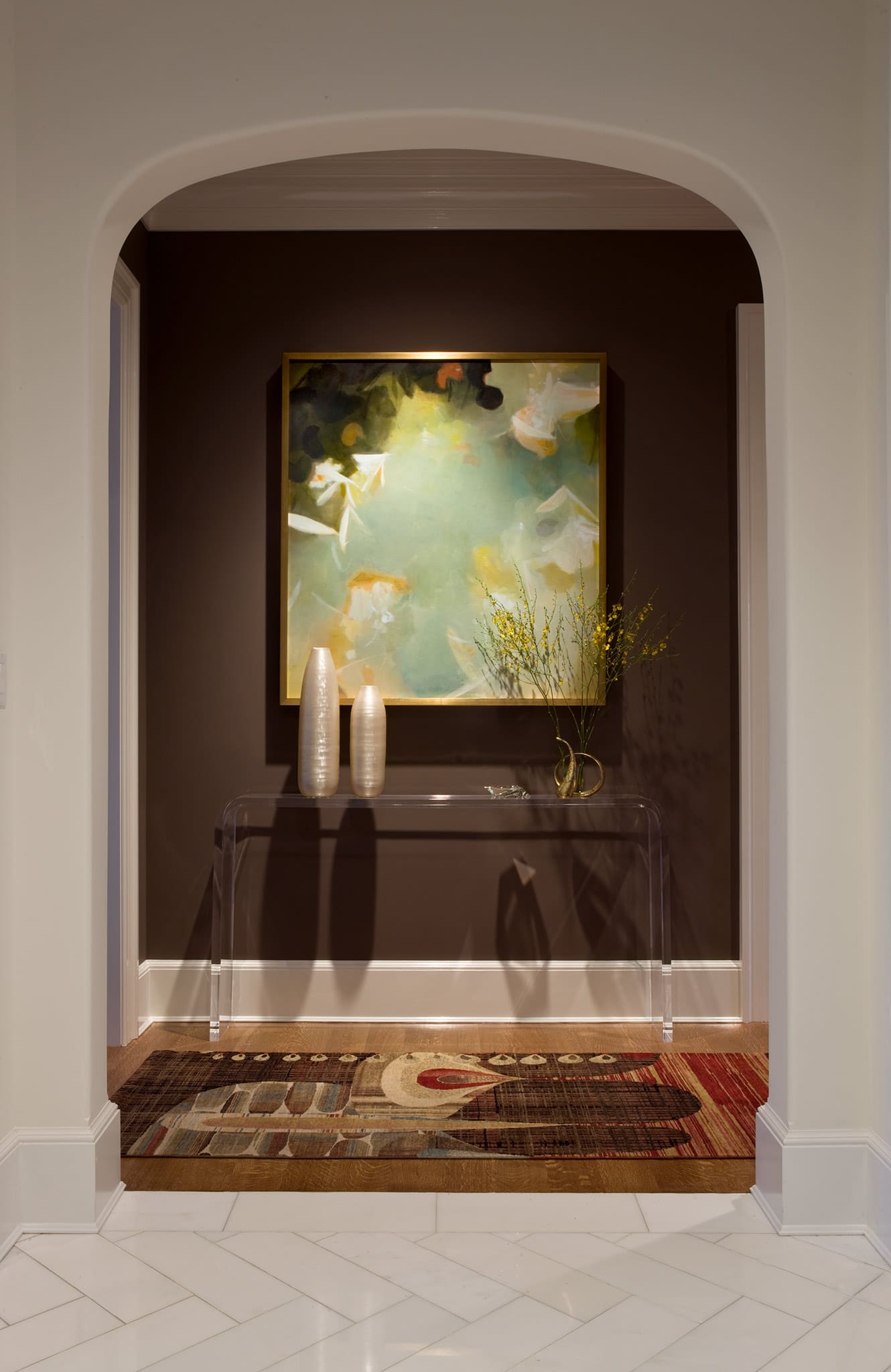 Entry foyer - archway, console and painting.