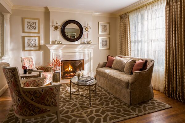 Living room with custom rug in a geometric pattern with neutral tones.