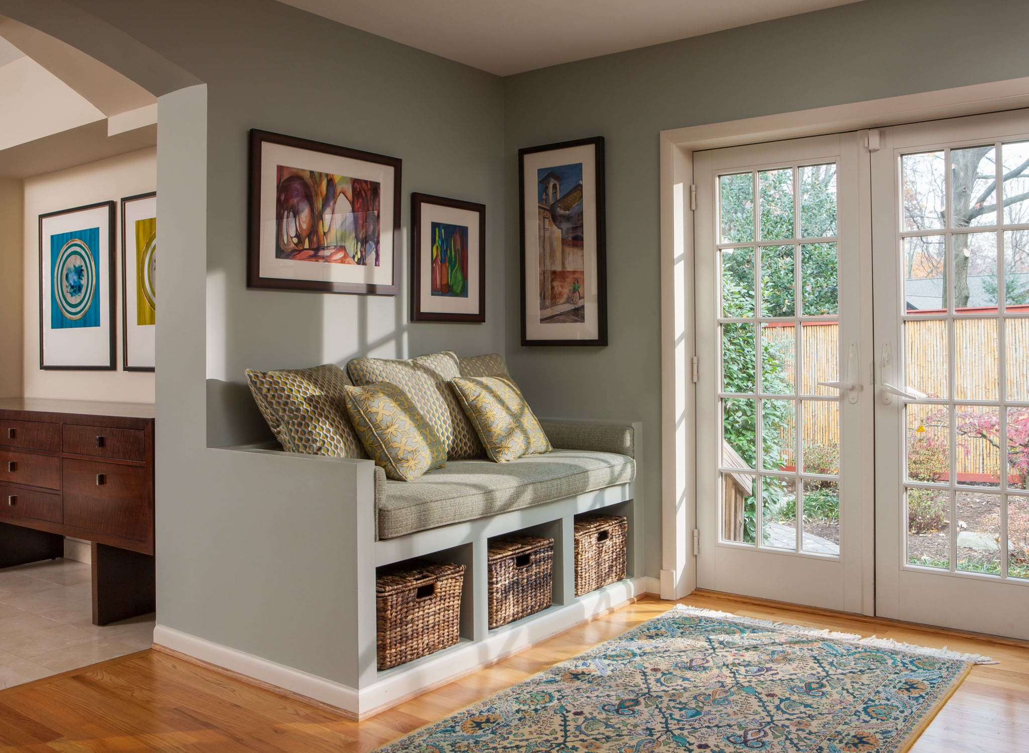 Storage solutions, sunny bench with baskets in Arlington, VA by A. Houck Designs.