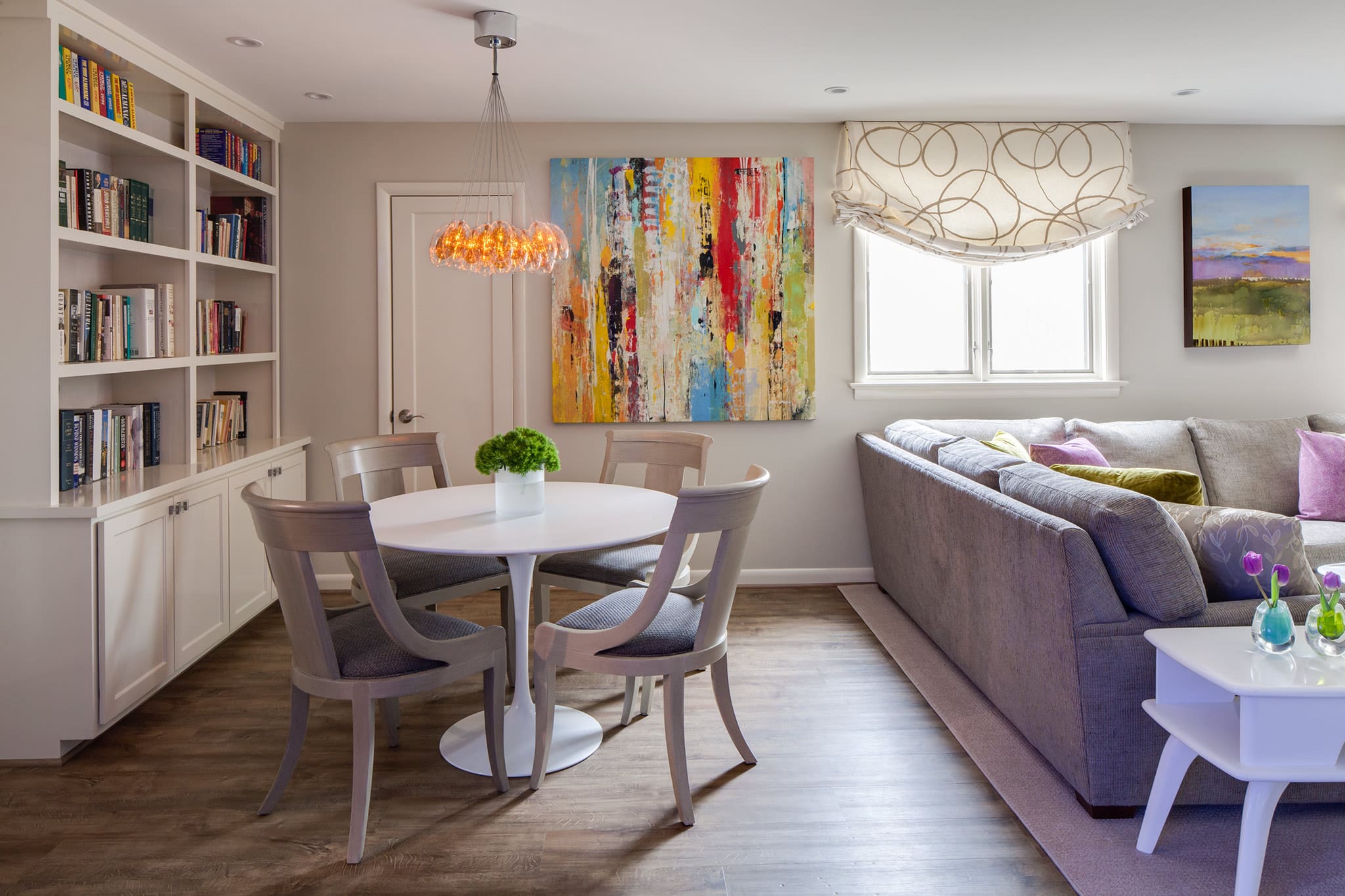 Modern interior design, bookshelf, sectional, game or craft table in Arlington, VA by A. Houck Designs.