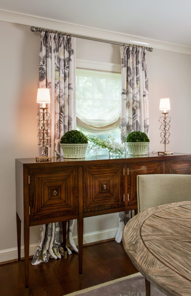 Dining room sideboard with custom glass buffet lamps.
