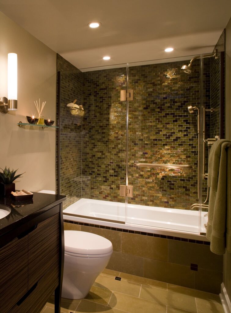 Glass mosaic tile and zebrawood vanity in luxurious bath by A. Houck Designs.