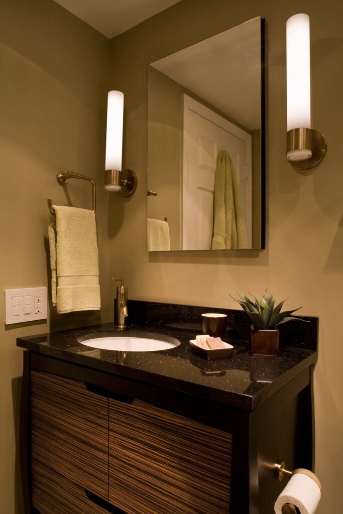 Earth tones, vanity lights in bathroom by A. Houck Designs.