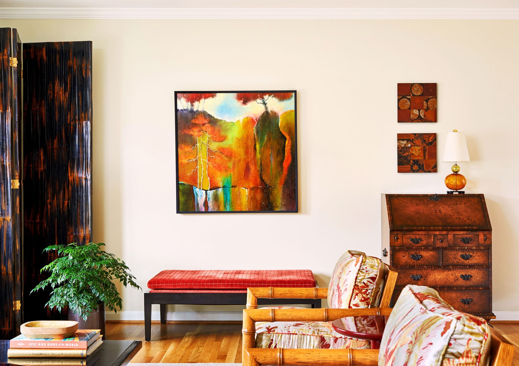 Vibrant artwork in eclectic design living room in Bethesda, MD by A. Houck Designs.