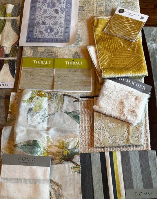 Fabric swatches and furniture layout plan for the living room design, featuring neutral tones and patterns.