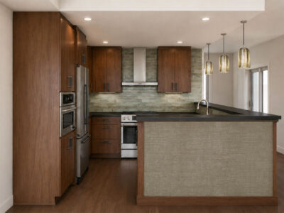 Modern kitchen with wood cabinets, stainless steel appliances, tile backsplash, and pendant lighting over peninsula.